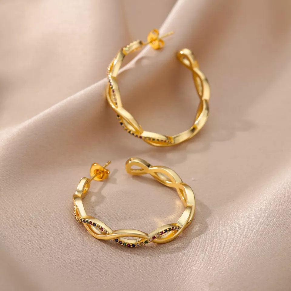 Clara | Orecchini a onde in oro 18 carati